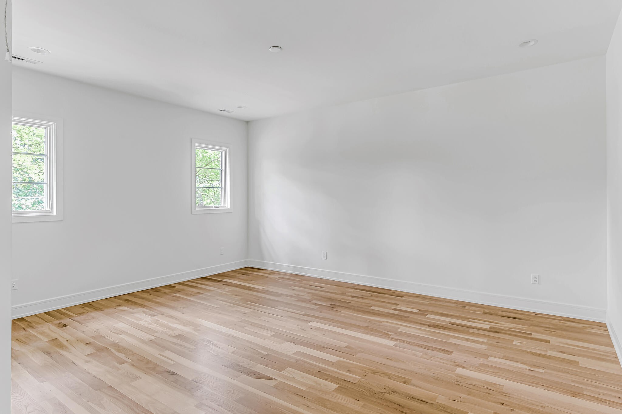 1401 Burton Valley Road Nashville, TN 37215 - Photo 61 of 68 a view of an empty room with wooden floor and a window