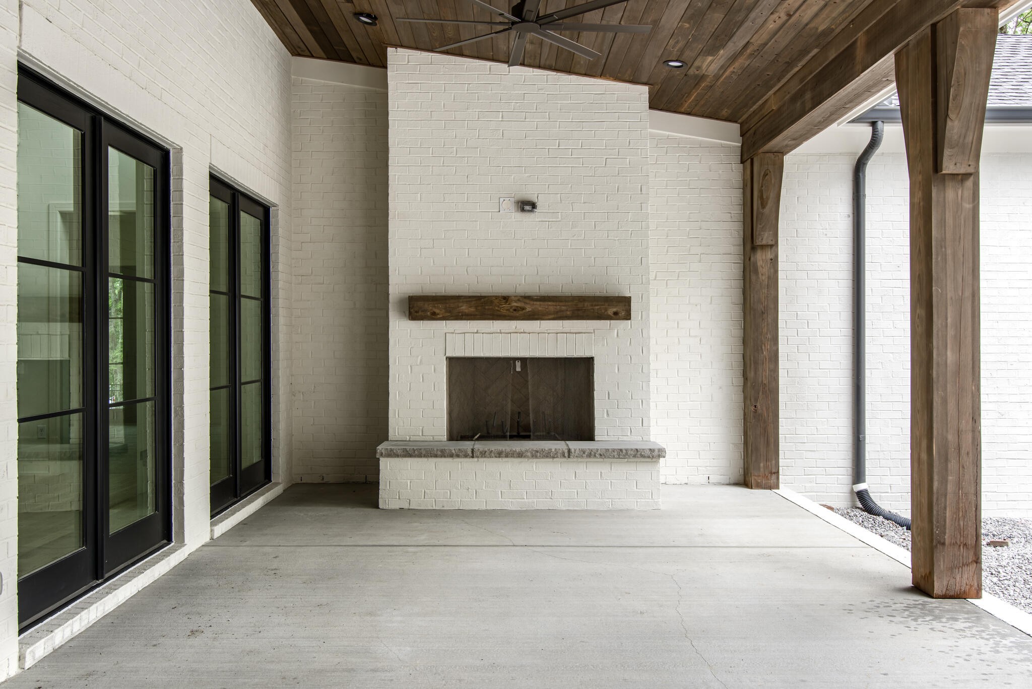 1401 Burton Valley Road Nashville, TN 37215 - Photo 63 of 68 a living room with a fireplace and a rug
