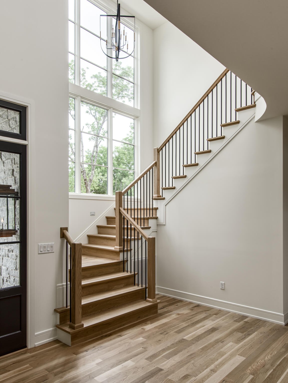 1401 Burton Valley Road Nashville, TN 37215 - Photo 8 of 68 a view of entryway with wooden floor and stairs