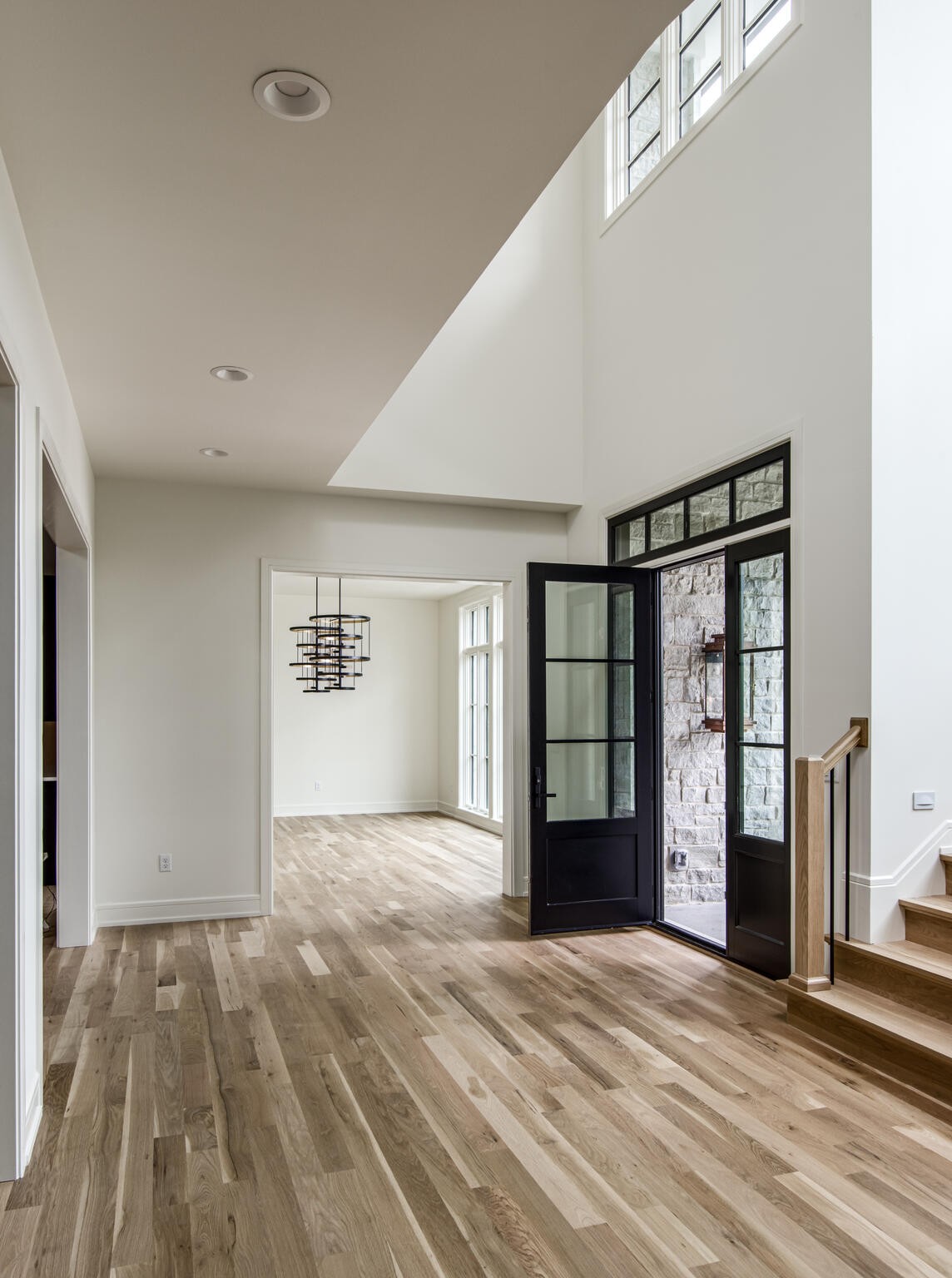 1401 Burton Valley Road Nashville, TN 37215 - Photo 9 of 68 a view of an empty room with a window and wooden floor