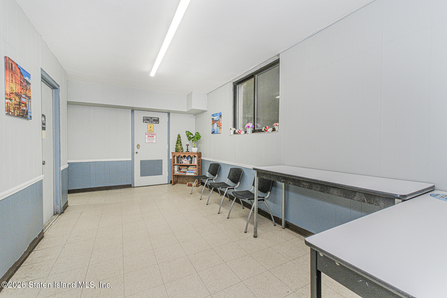5 Windham Loop, Unit 7I Staten Island, NY 10314 - Photo 12 of 20 a room with furniture and a table