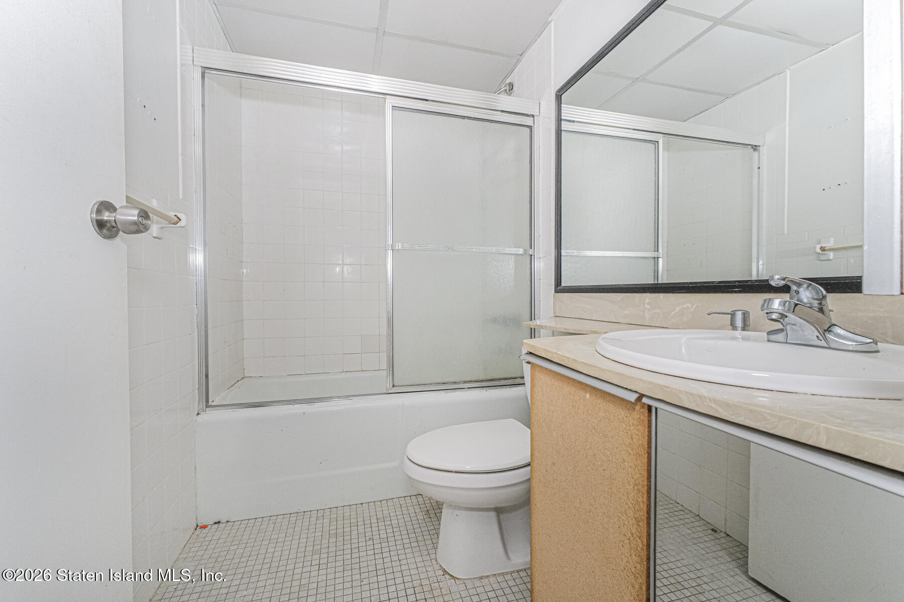 5 Windham Loop, Unit 7I Staten Island, NY 10314 - Photo 16 of 20 a bathroom with a granite countertop sink toilet and shower