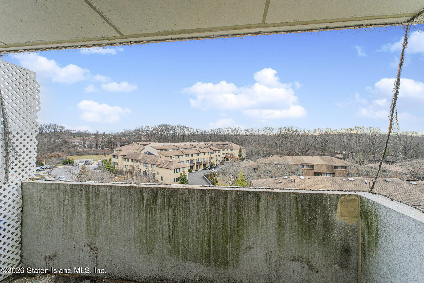 5 Windham Loop, Unit 7I Staten Island, NY 10314 - Photo 19 of 20 a view of a lake in middle of the house