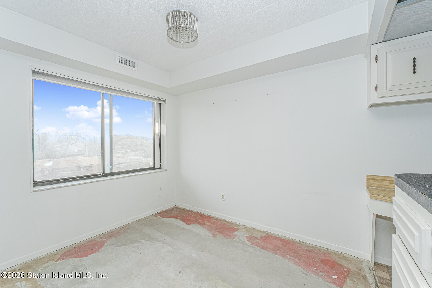 5 Windham Loop, Unit 7I Staten Island, NY 10314 - Photo 6 of 20 a view of an empty room with a window