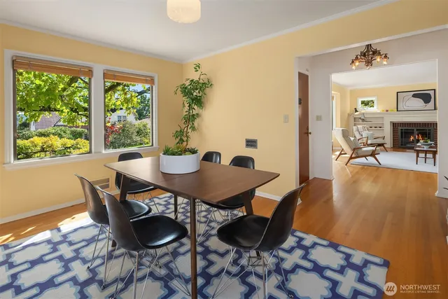 a view of a dining room with furniture and a large window