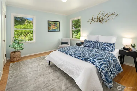 a bedroom with bed and a window