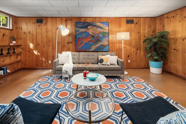 a living room filled with furniture and rug