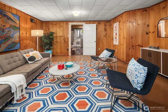a living room filled with furniture and a rug