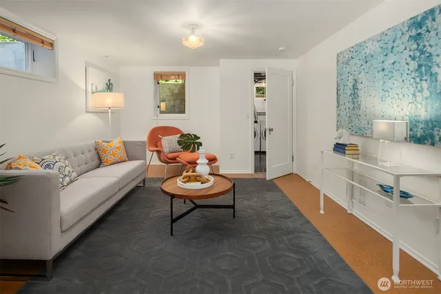 a living room with furniture and wooden floor