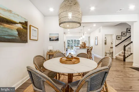 a living room with furniture and view of kitchen