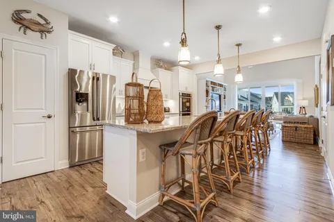a large kitchen with granite countertop lots of counter top space
