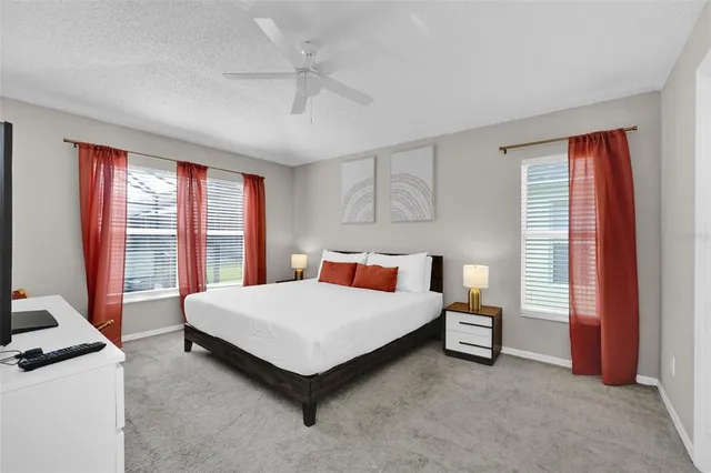 a room with a bed and a table chair