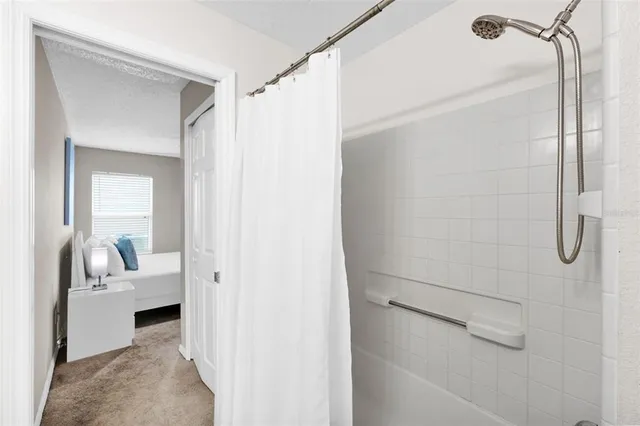 a view of a bedroom from a bathroom