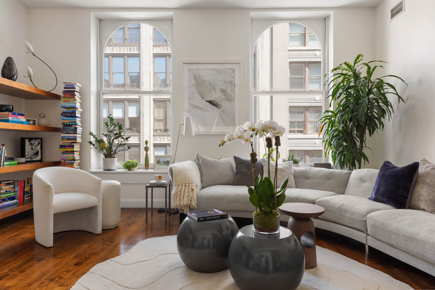 42 East 20th Street, Unit 7A Manhattan, NY 10003 - Photo 4 of 13 a living room with furniture potted plant and a large window