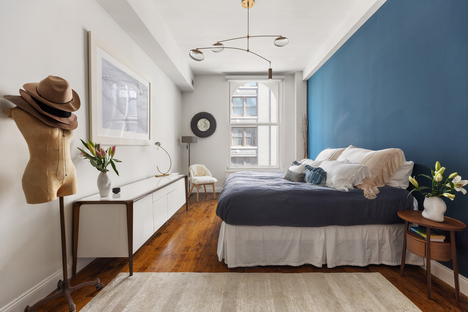 42 East 20th Street, Unit 7A Manhattan, NY 10003 - Photo 8 of 13 a living room with furniture and a large window