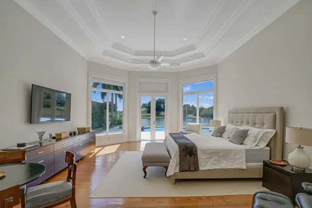 a bedroom with a bed window and couch
