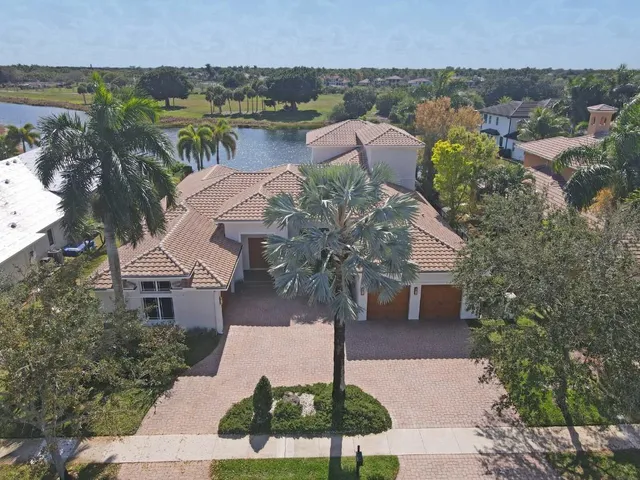 a picture of houses with outdoor space and lake view