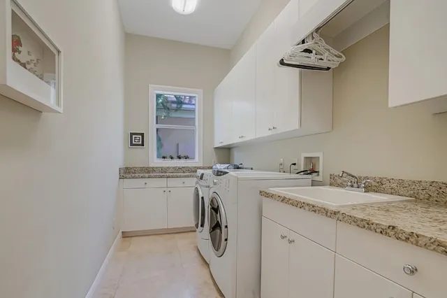 a bathroom with a granite countertop sink mirror and vanity