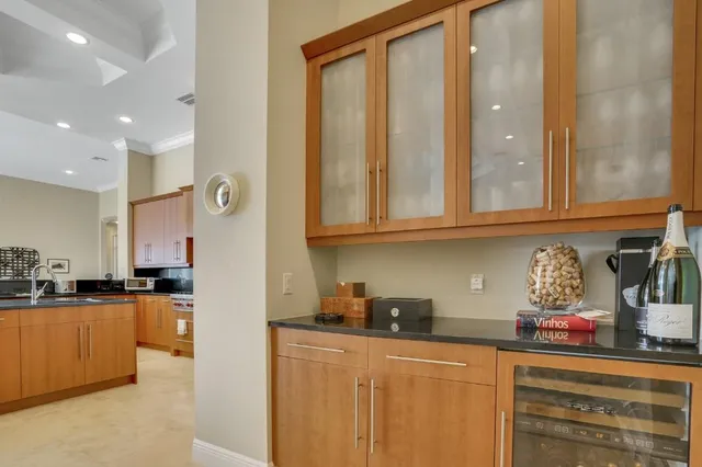 a kitchen with stainless steel appliances granite countertop a sink and cabinets