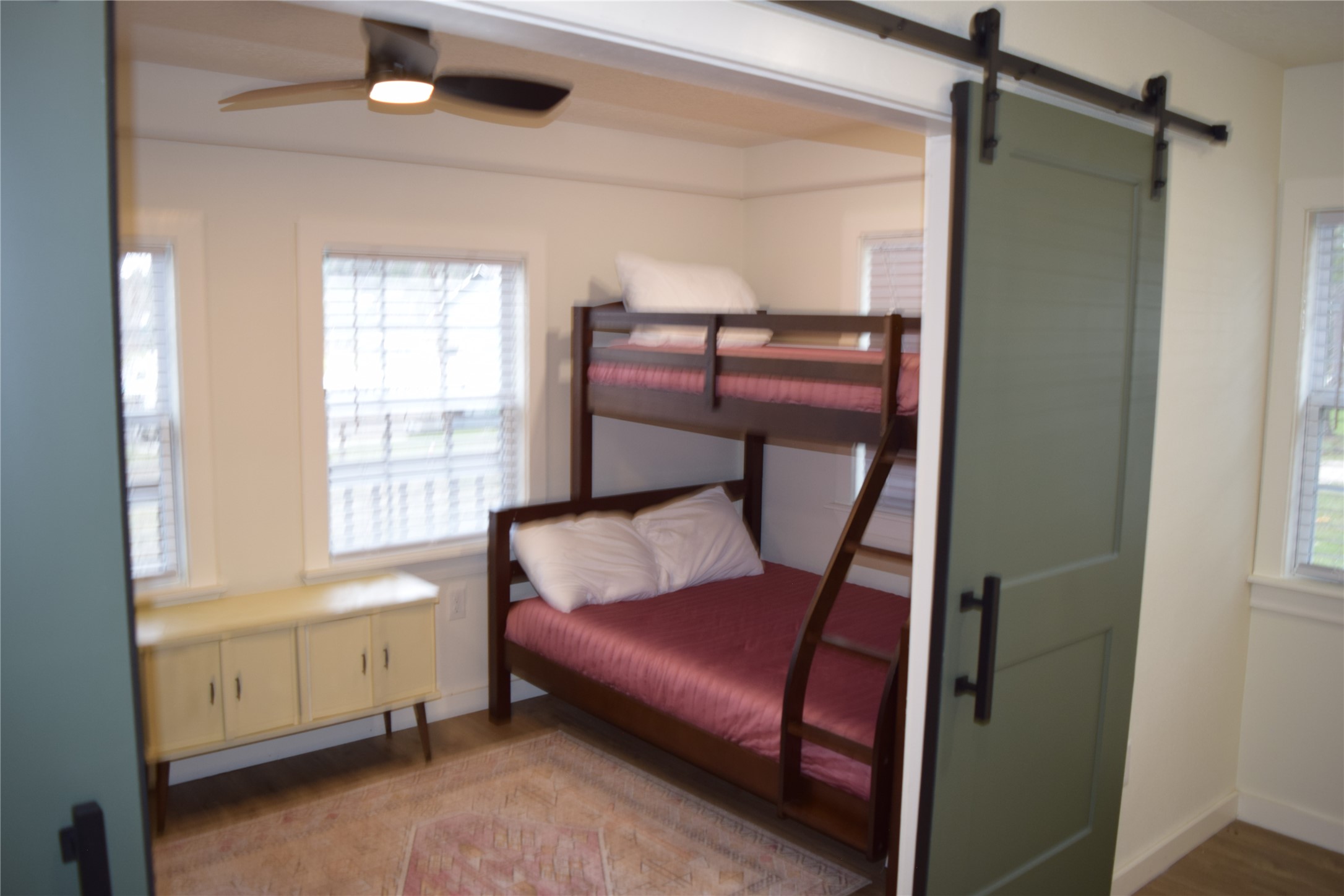 237 Shawnee Drive Onalaska, TX 77360 - Photo 12 of 32 a bedroom with a bed and a window