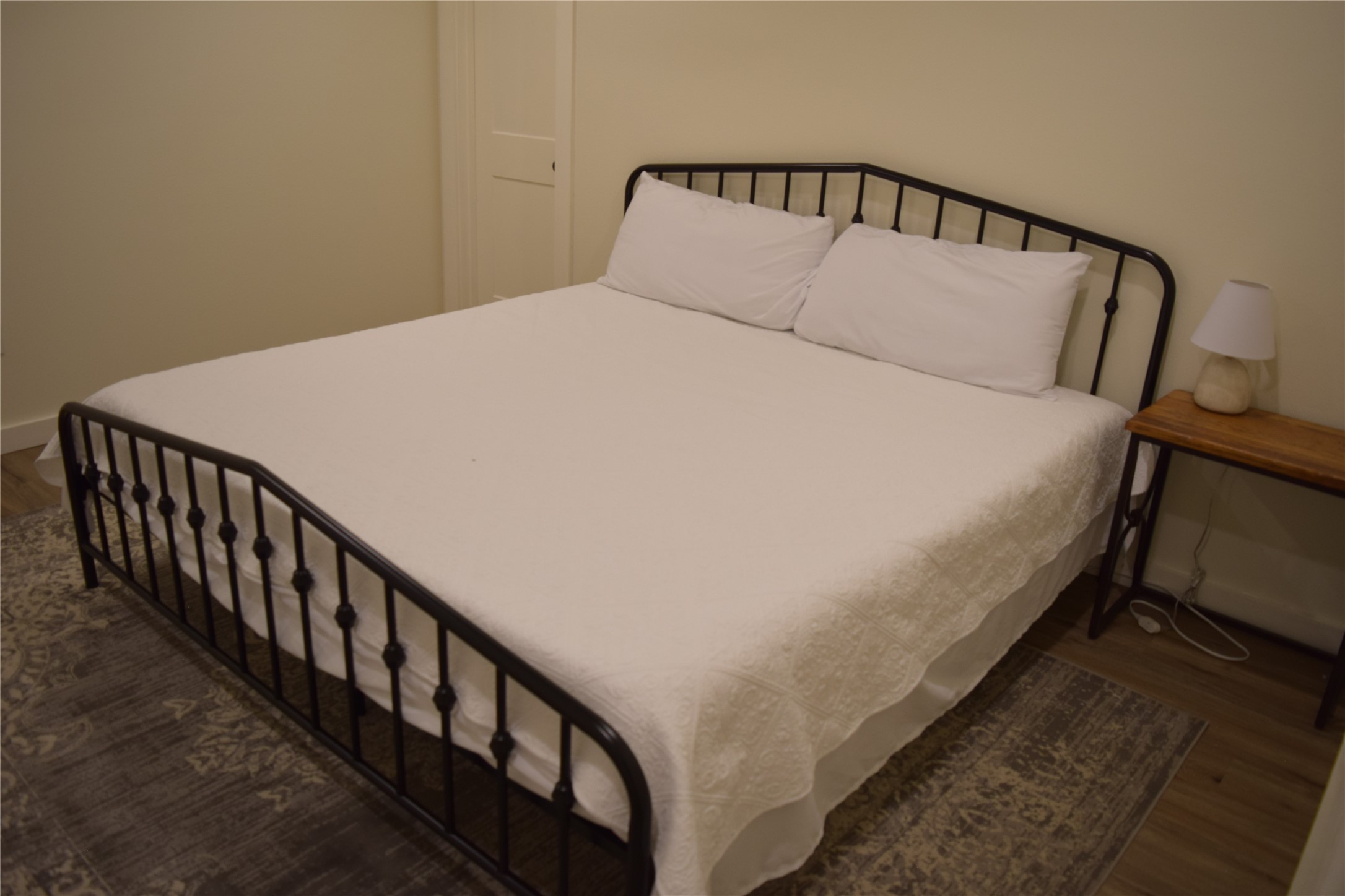 237 Shawnee Drive Onalaska, TX 77360 - Photo 21 of 32 a large bed sitting in a bedroom next to a window