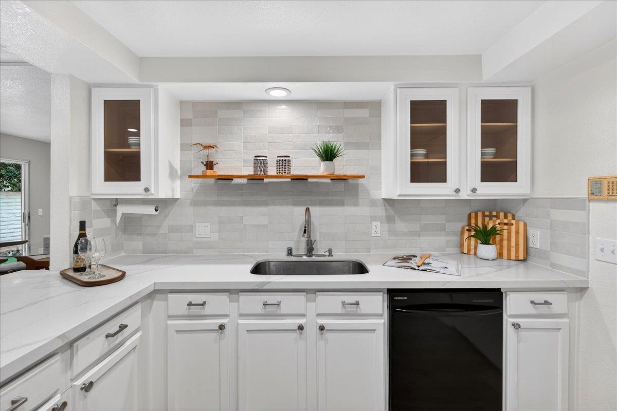 244 Rachael Place Pleasanton, CA 94566 - Photo 9 of 24 a kitchen with a sink cabinets and window