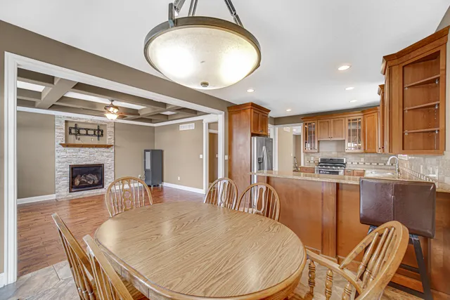 a large kitchen with a table and chairs
