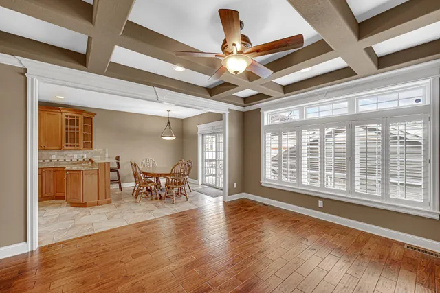 a view of a livingroom with furniture and a large window