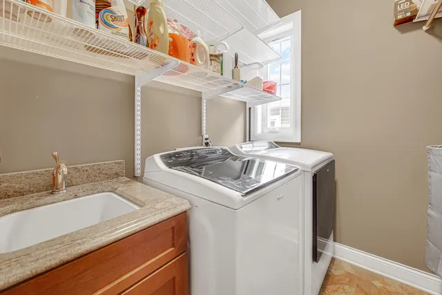 a utility room with washer and dryer