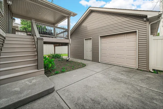 a house with green field in front of it