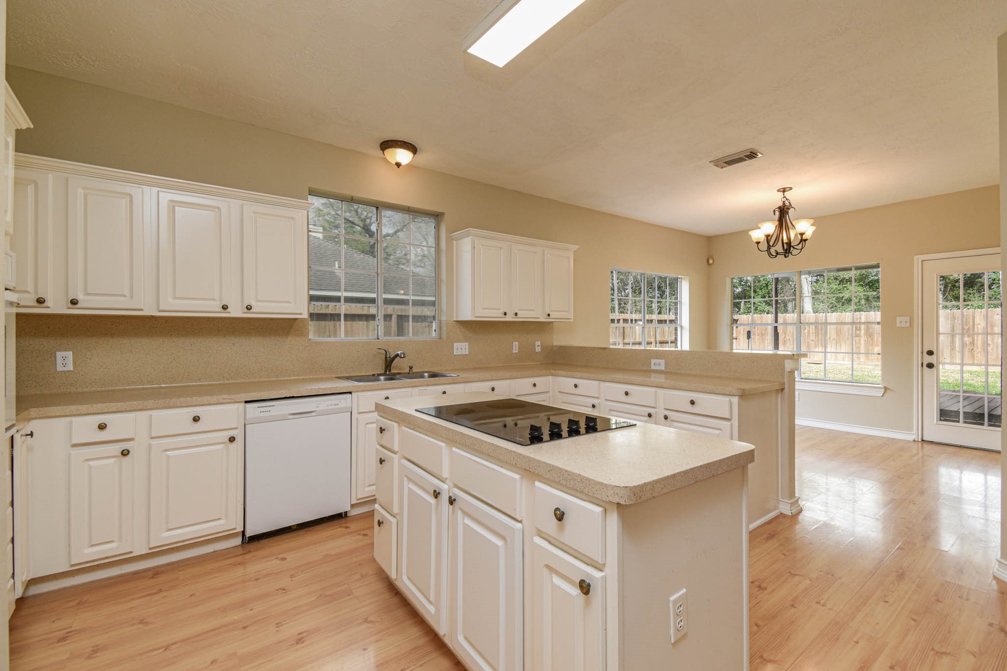 8806 Edenbridge Street Spring, TX 77379 - Photo 12 of 25 a kitchen with cabinets stove and sink