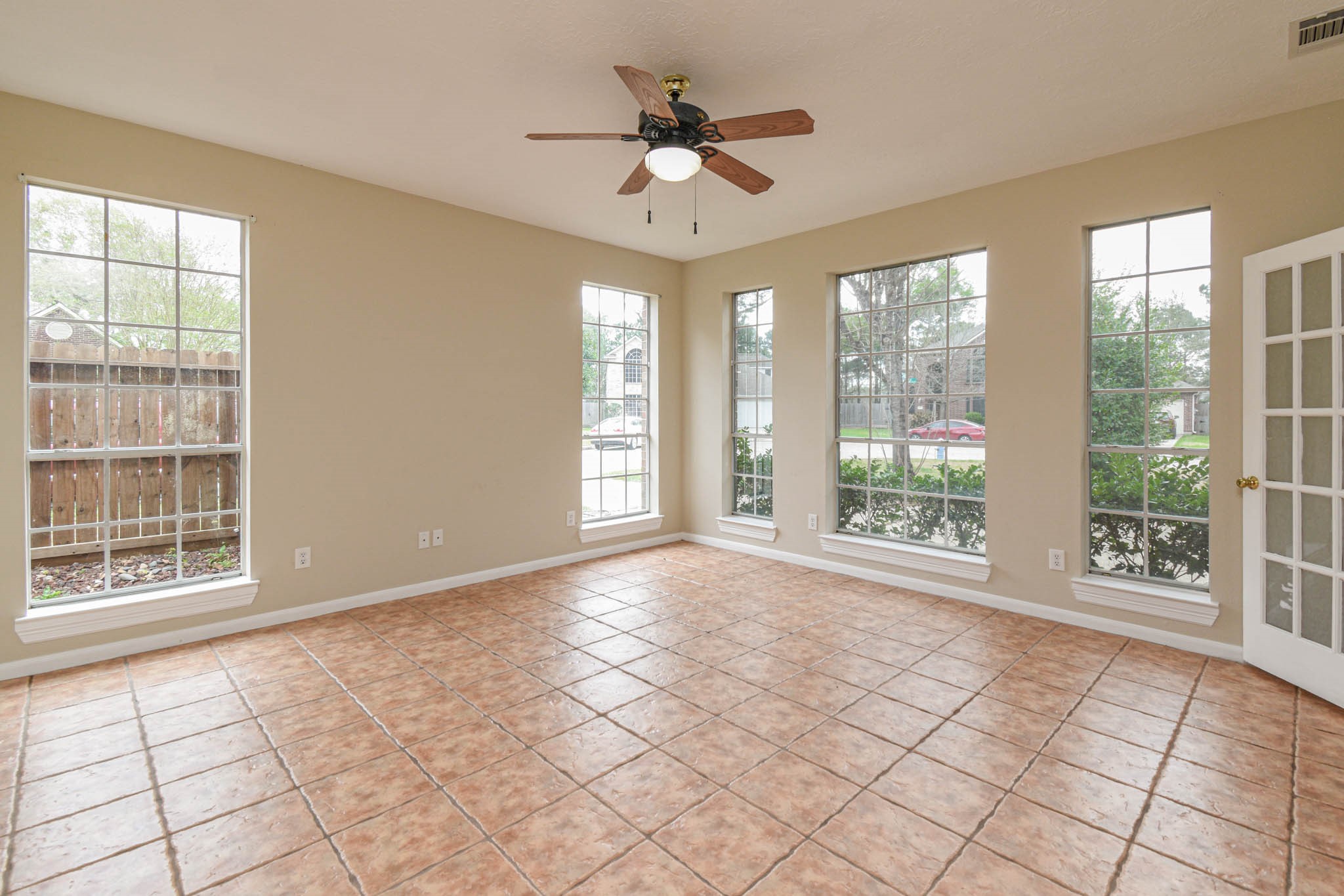 8806 Edenbridge Street Spring, TX 77379 - Photo 18 of 25 a view of an empty room with a window