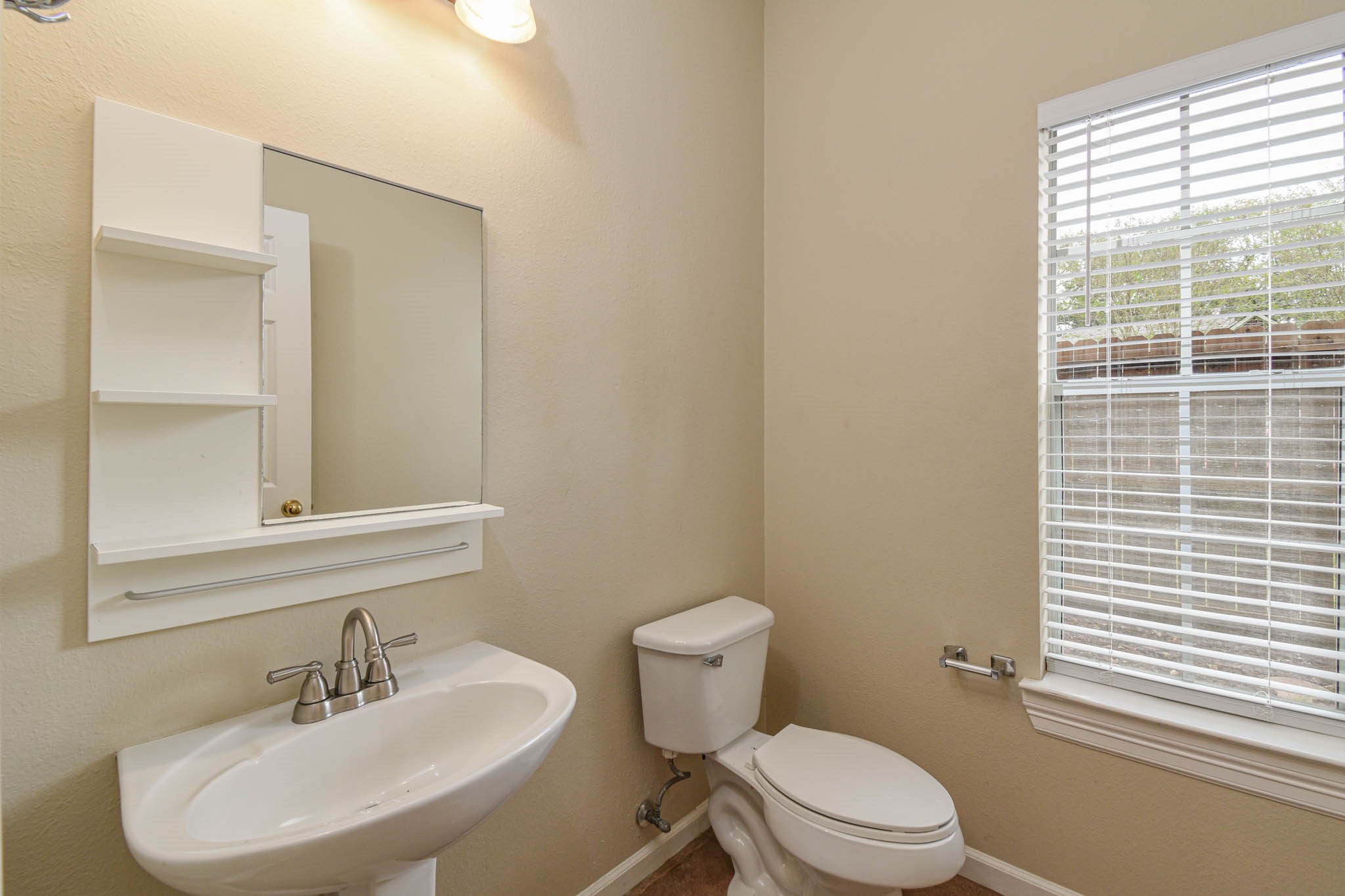 8806 Edenbridge Street Spring, TX 77379 - Photo 19 of 25 a bathroom with a sink a toilet and shower