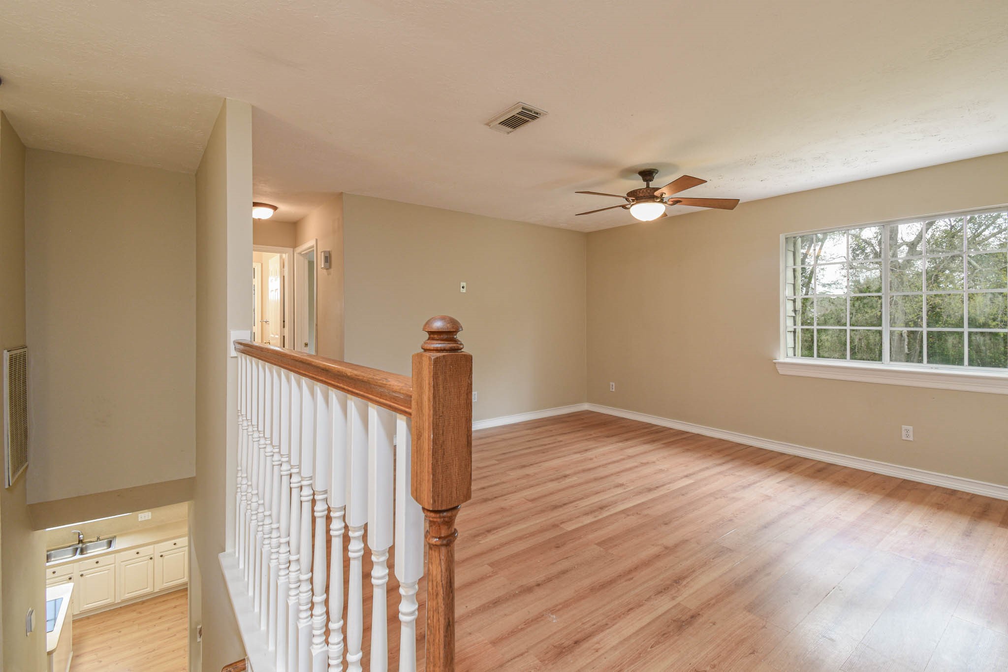 8806 Edenbridge Street Spring, TX 77379 - Photo 23 of 25 a view of an empty room with a window