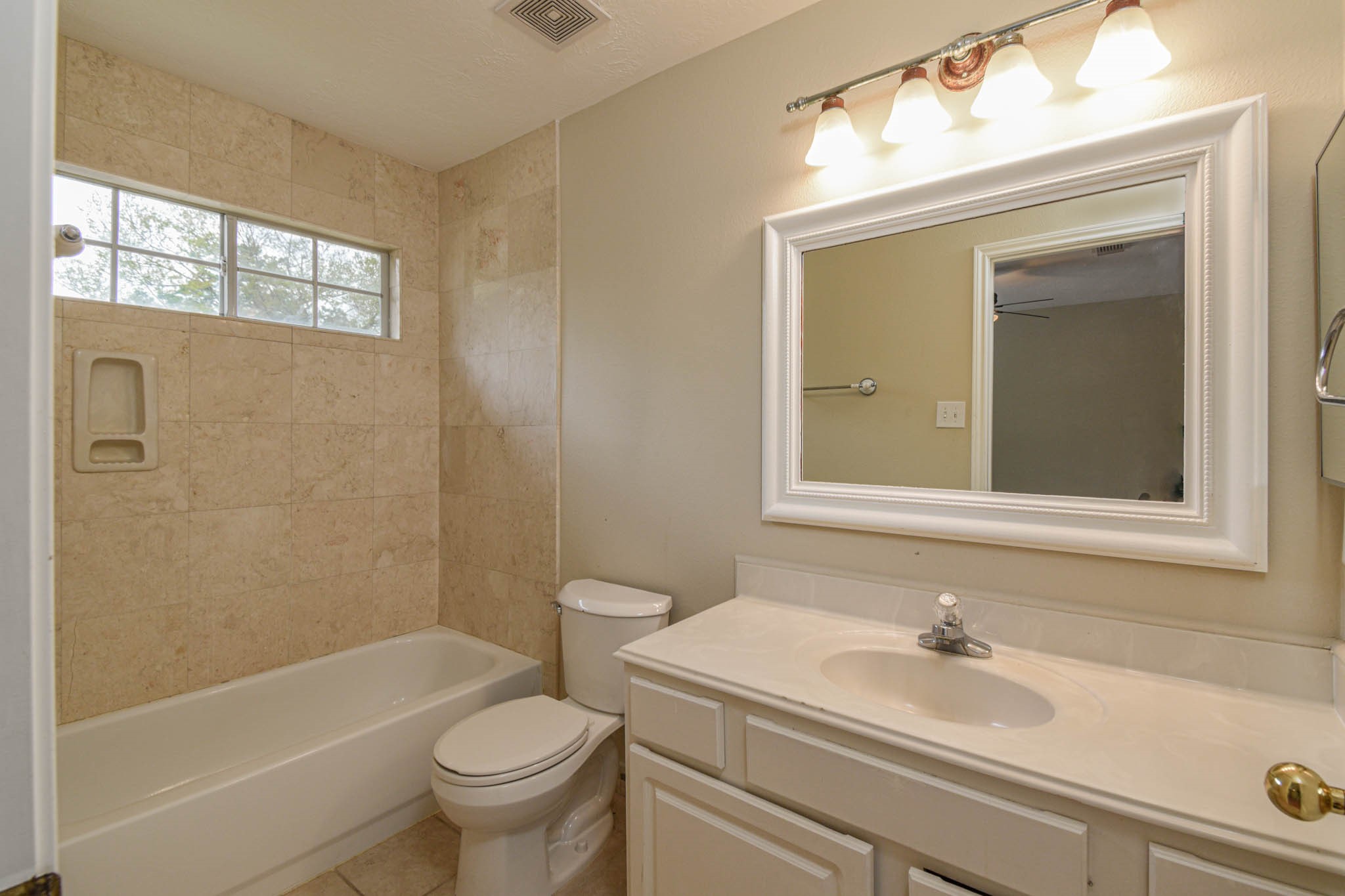 8806 Edenbridge Street Spring, TX 77379 - Photo 25 of 25 a bathroom with a sink a toilet and shower