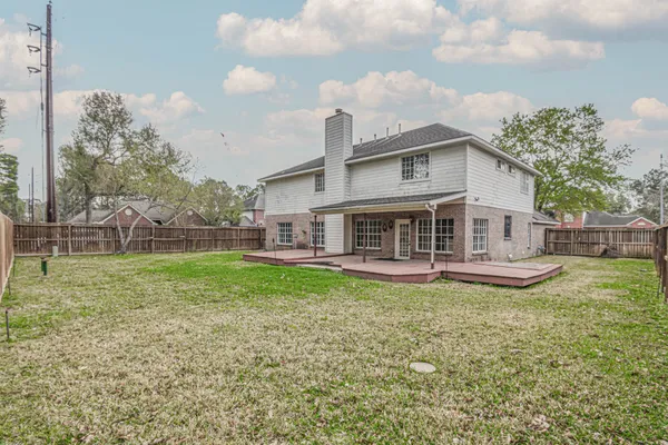 a view of a house with a yard porch and sitting area
