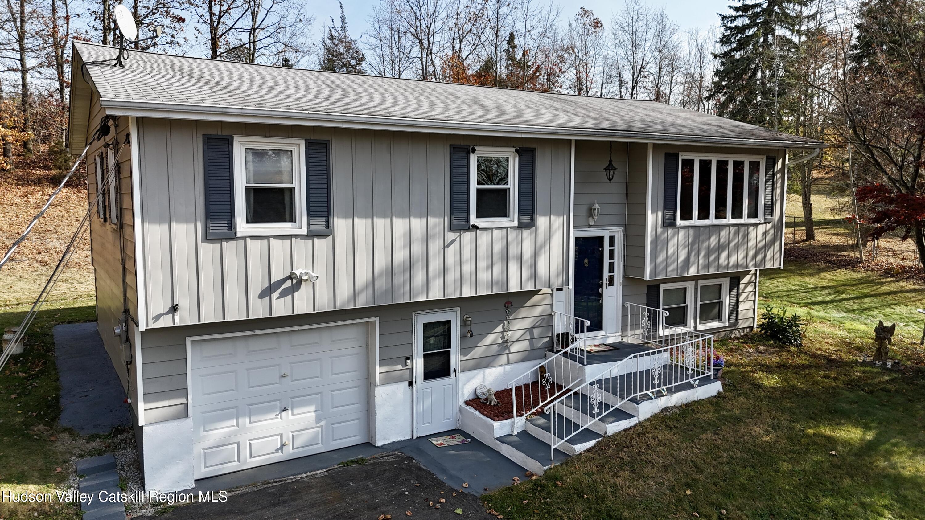 322 Plattekill Ardonia Road Wallkill, NY 12589 - Photo 2 of 22 a front view of a house with a garden
