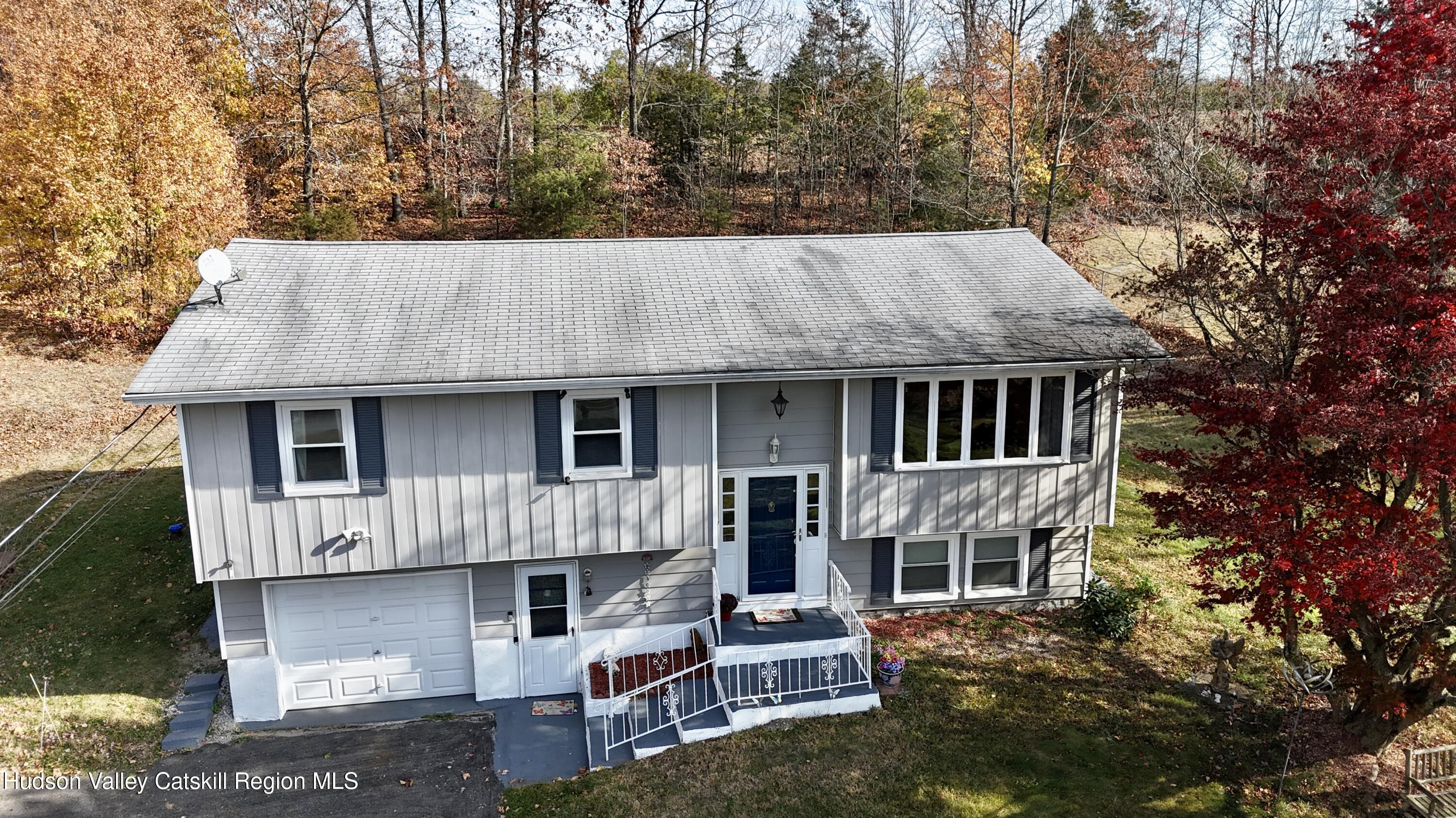 322 Plattekill Ardonia Road Wallkill, NY 12589 - Photo 3 of 22 a aerial view of a house with a yard and large tree