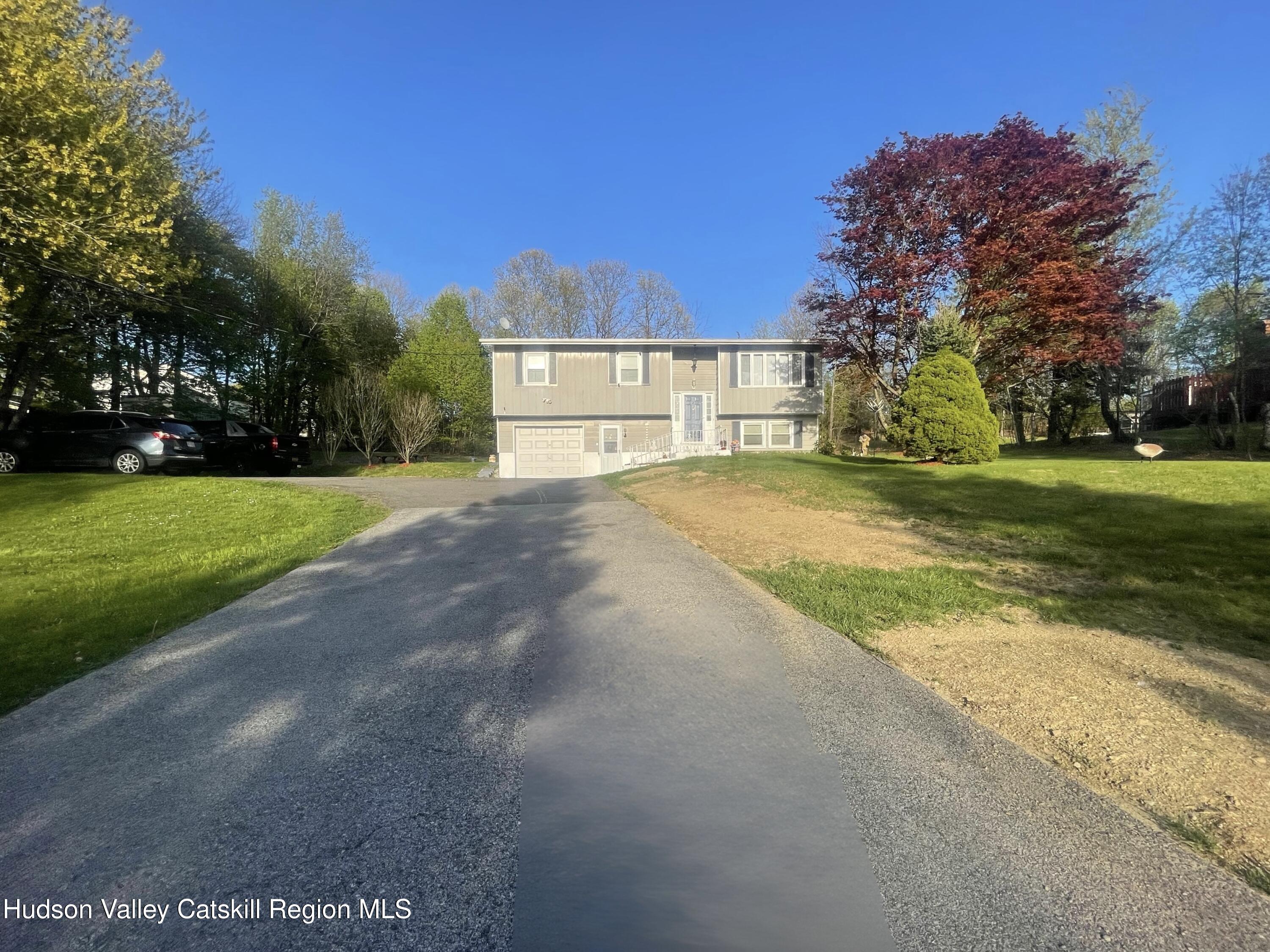 322 Plattekill Ardonia Road Wallkill, NY 12589 - Photo 5 of 22 a view of a house with a yard and basketball court