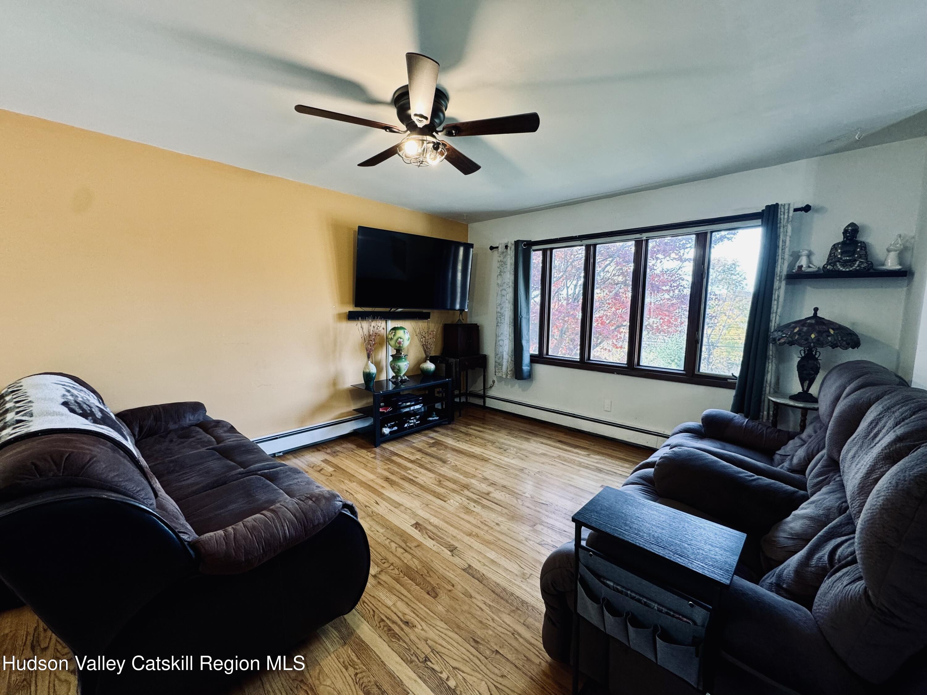 322 Plattekill Ardonia Road Wallkill, NY 12589 - Photo 9 of 22 a living room with furniture and a flat screen tv