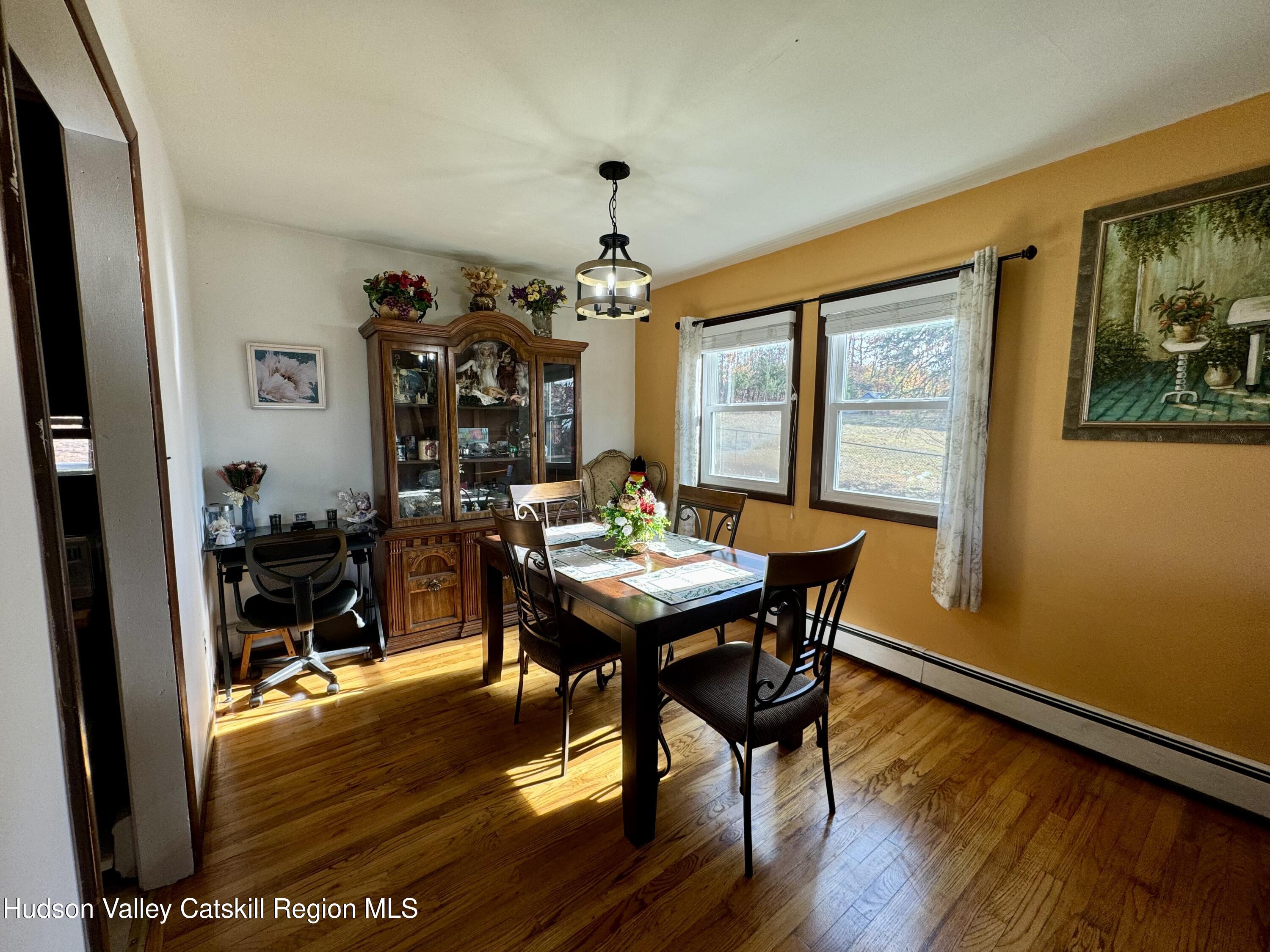 322 Plattekill Ardonia Road Wallkill, NY 12589 - Photo 10 of 22 a view of a dining room with furniture window and wooden floor