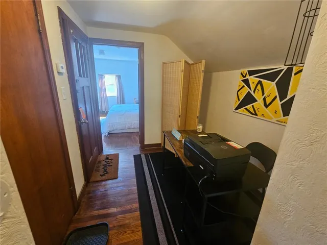 a room with furniture and wooden floor