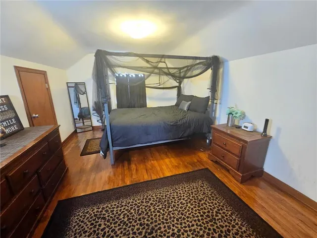 a bedroom with furniture and a dresser
