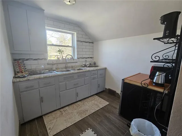 a kitchen with sink cabinets and window