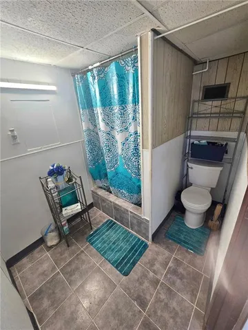 a room with wooden floor and a chair