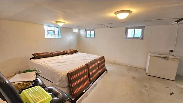 a room with a bed and a chair