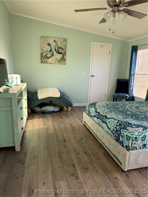 3082 Alamac Road Lumberton, NC 28358 - Photo 19 of 30 a bedroom with a bed and a chandelier