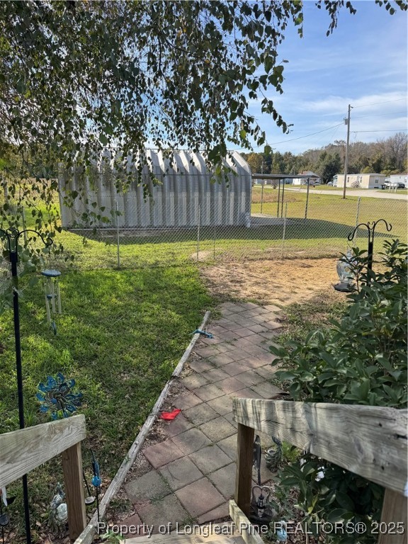 3082 Alamac Road Lumberton, NC 28358 - Photo 25 of 30 a view of a garden with an outdoor space