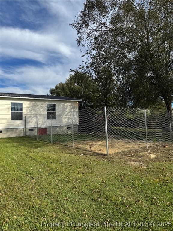 3082 Alamac Road Lumberton, NC 28358 - Photo 26 of 30 a house with a yard