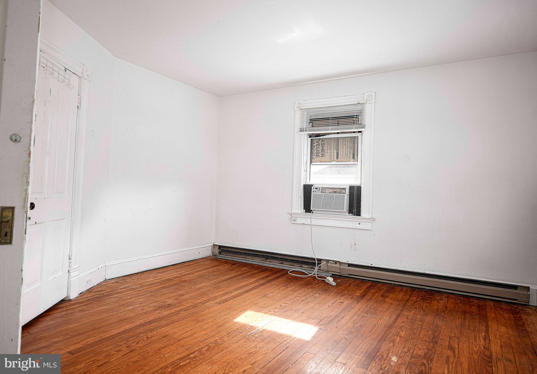 1531 Perryman Road Aberdeen, MD 21001 - Photo 11 of 23 a view of an empty room with wooden floor and a window